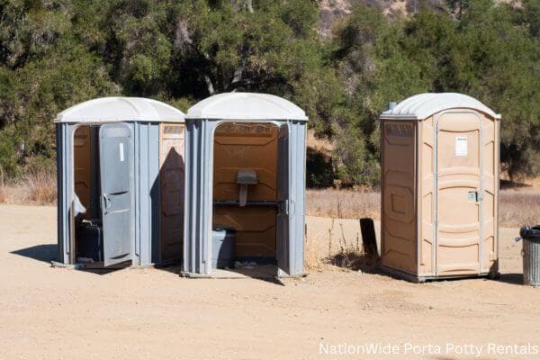 a clean row of portable restrooms for outdoor weddings or festivals in Great Bend, KS